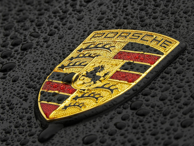 emblem of Porsche with water drizzle