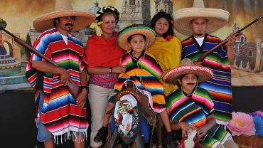 a mexican family wearing mexican costume